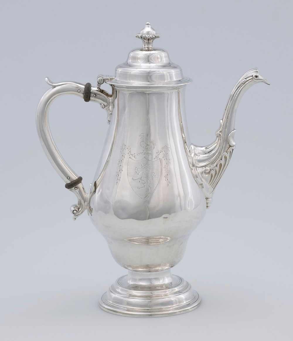 coffee pot, vase-shaped with long spout and 'S' scrolled handle; base of spout decorated with leaf motif; engraved crest on…