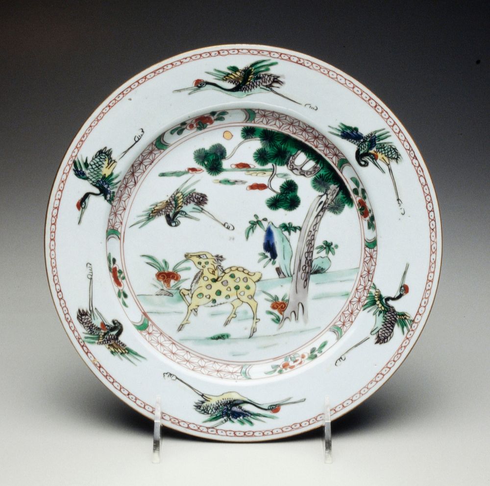 famille verte plate decorated with yellow spotted deer on grassy bank and crane in flight, floral patterned border with 6…