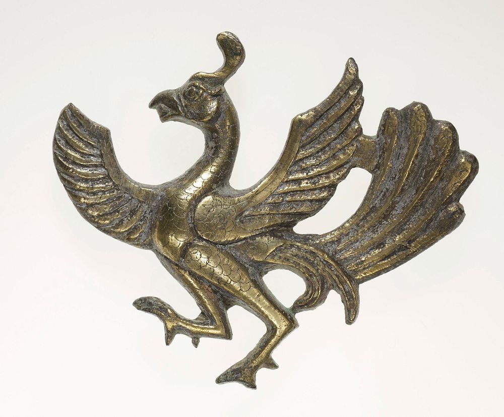 prancing bird with wings outstretched; long tailfeathers; facing L. Original from the Minneapolis Institute of Art.