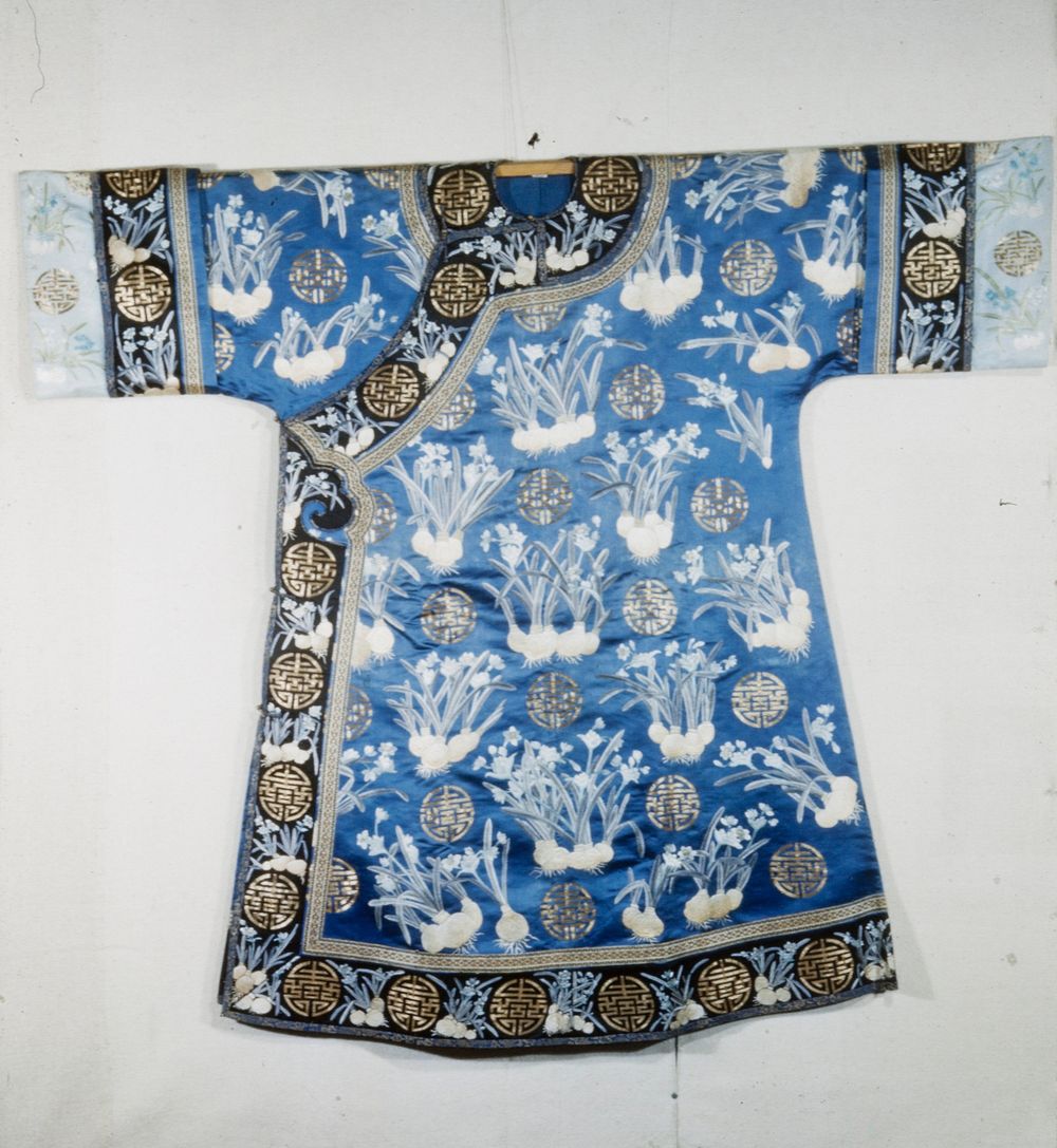 Empress robe of blue satin, attributed to Cixi, embroiderd with lily bulbs in shades of grey, pale blue-green and golden…