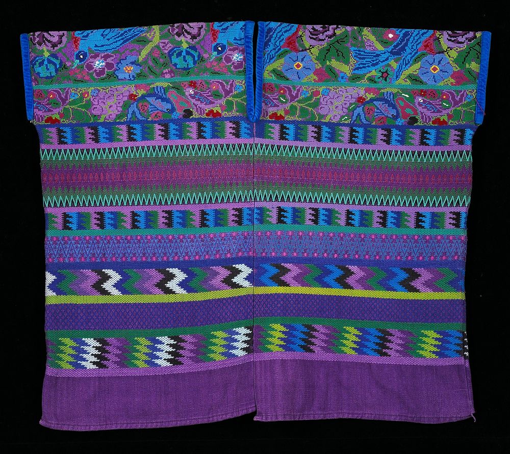 Two-panel huipil; full brocade in horizontal geometric patterns; supplementary weft patterning on sholders; Magenta ground…