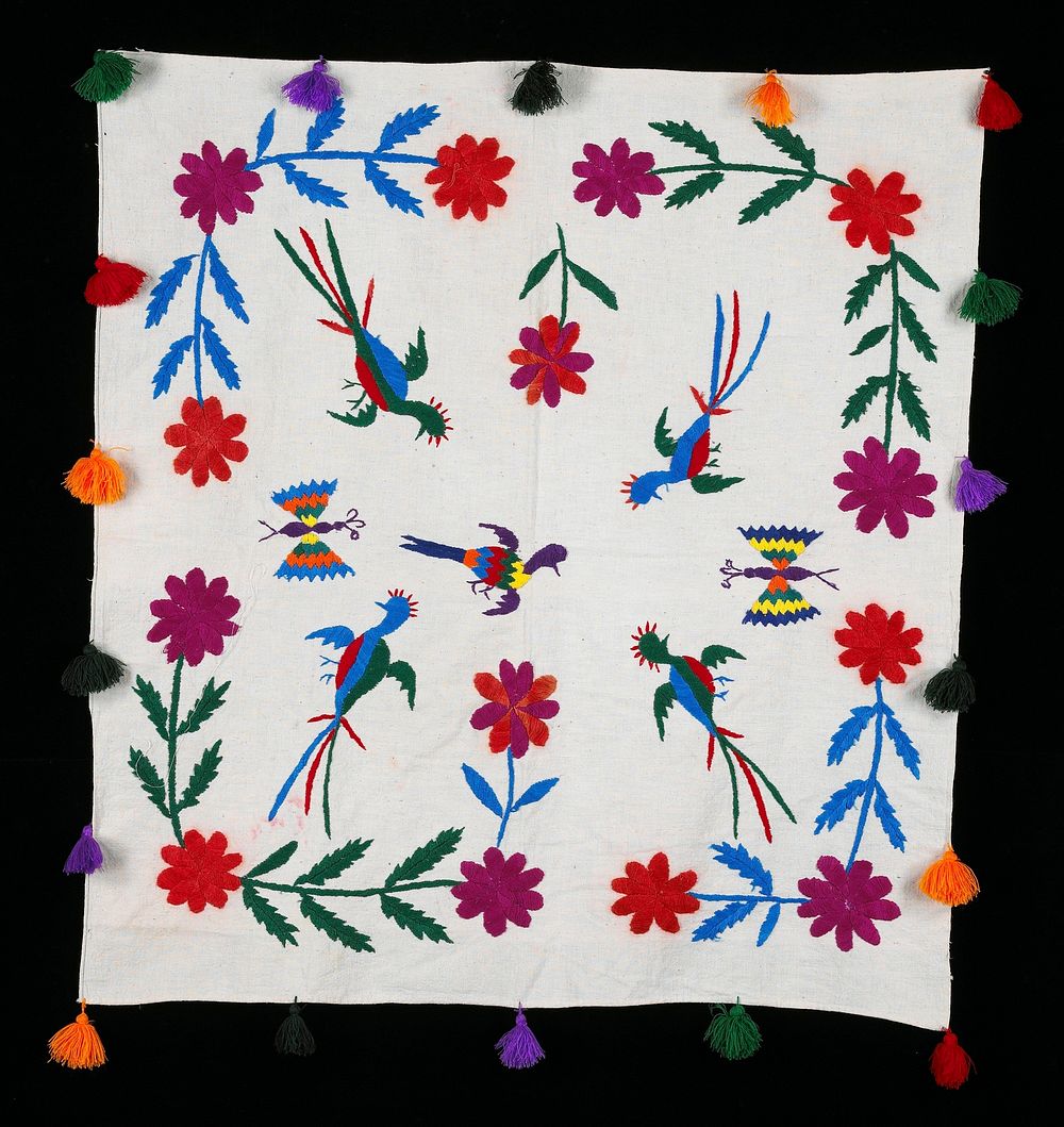 Hand embroidered on white background; multicolored flowers, butterflies and birds; tassles around the four selvedges..…