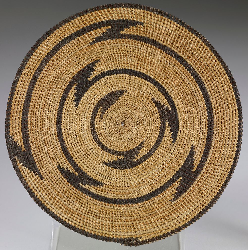 small round mat; tan ground with one radiating zigzag in brown; edged in brown. Original from the Minneapolis Institute of…