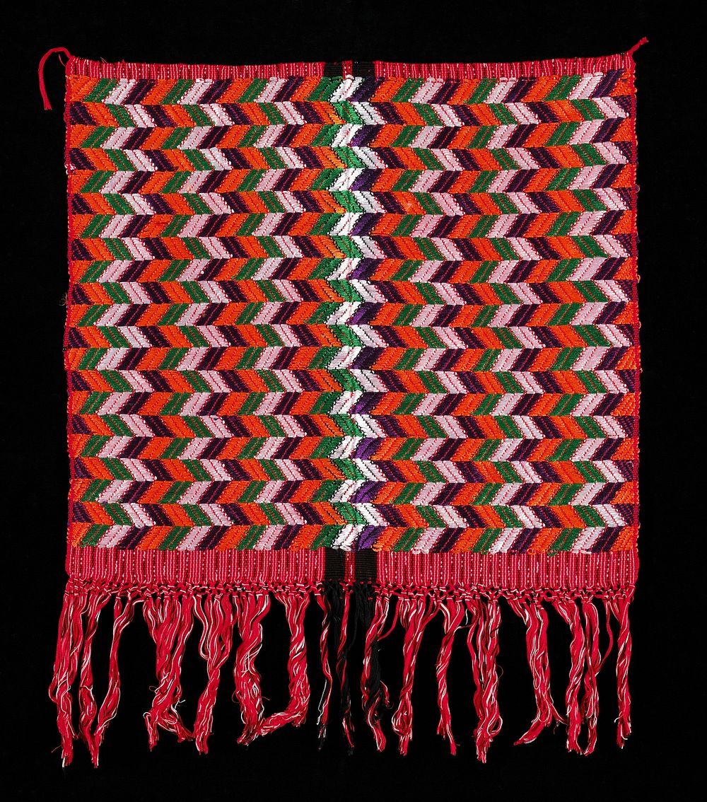 Red ground with fine black and white warp ikat stripes, intercepted by two fine white stripes; supplementary weft patterning…
