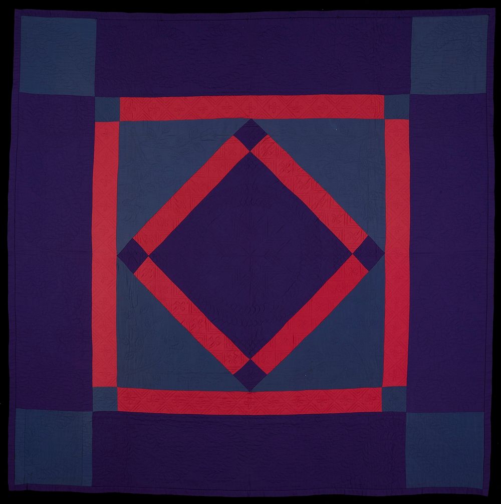 central diamond pattern; purple borders with blue corner blocks and feather wreath quilting; narrower inner border of…