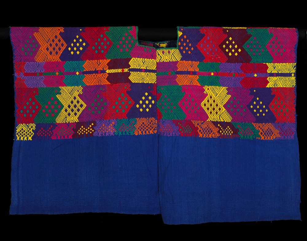 two wide blue cotton paneled huipil; woven on a back strap loom; brocaded with large multicolored zoomorphic designs…
