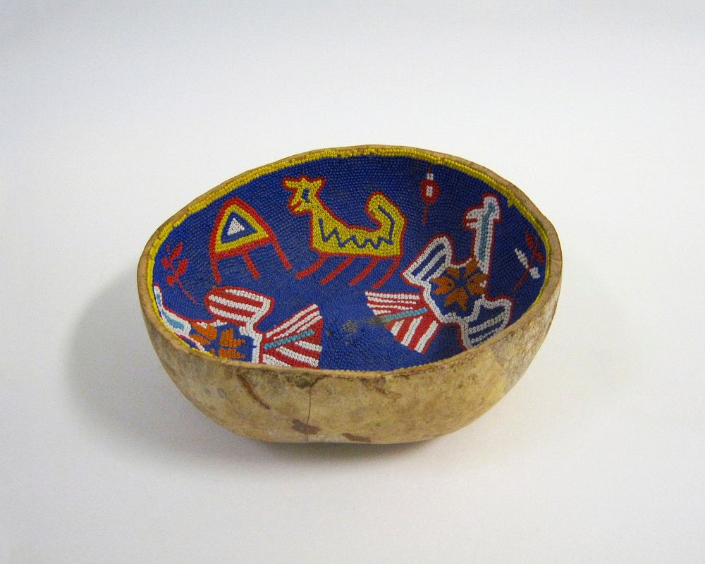 bowl made from lower portion of a gourd; interior beaded with two birds, two quadrupeds, butterfly and geometric designs in…