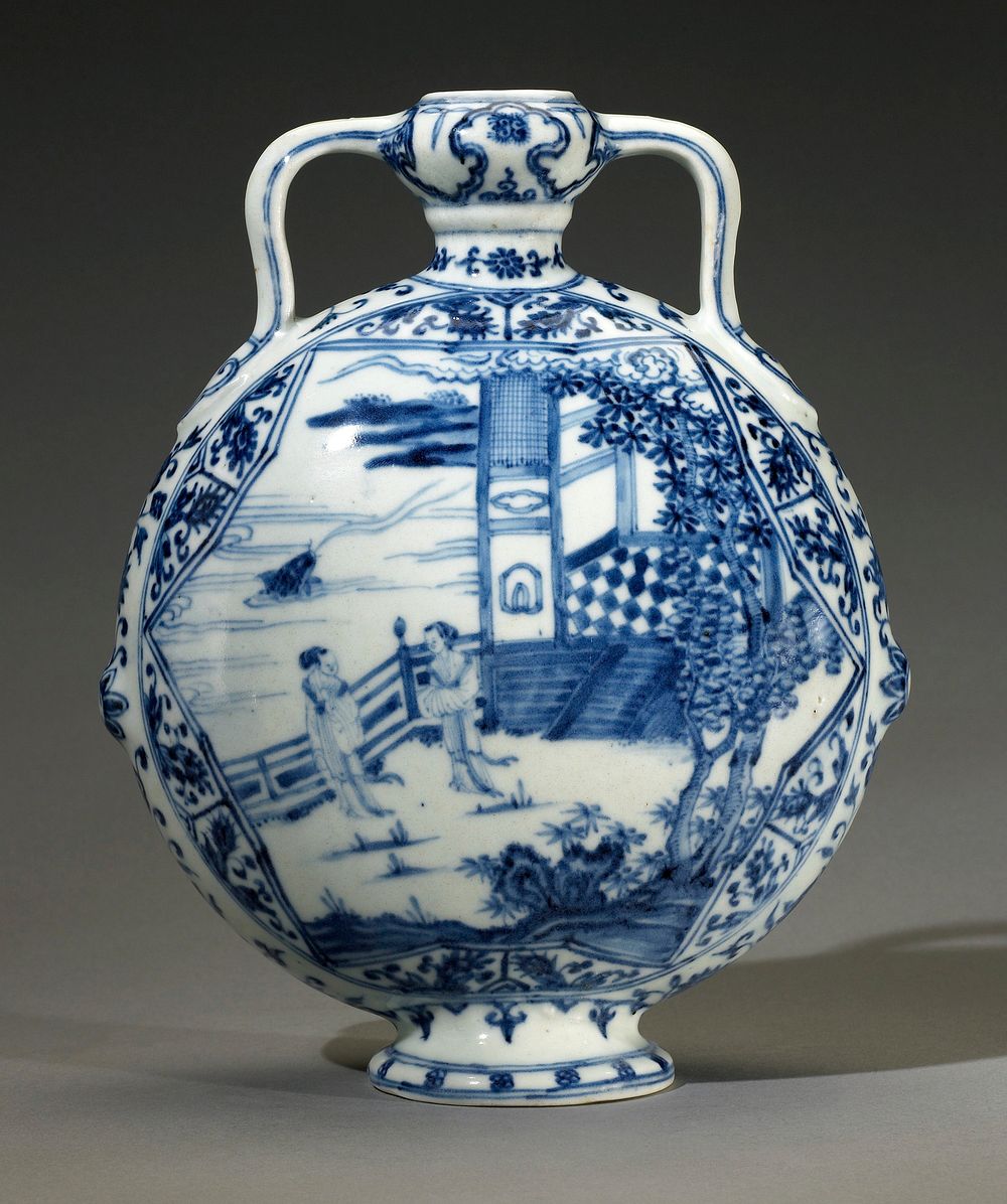 blue and white; flattened globular shape supported on a spreading pedestal foot with flat unglazed base containing a central…