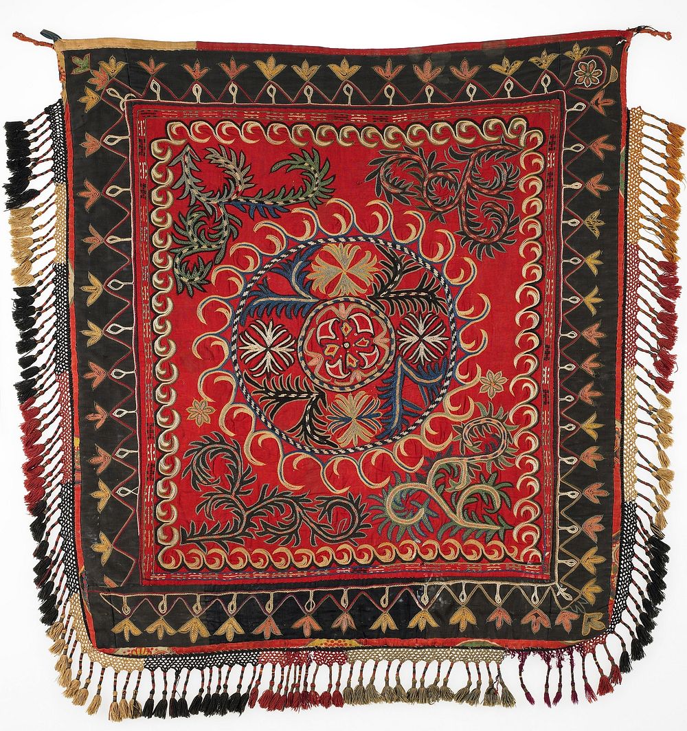 All cotton ground, pieced with a red center and black borders. Polychrome silk embroidery. The edges are bound in several…