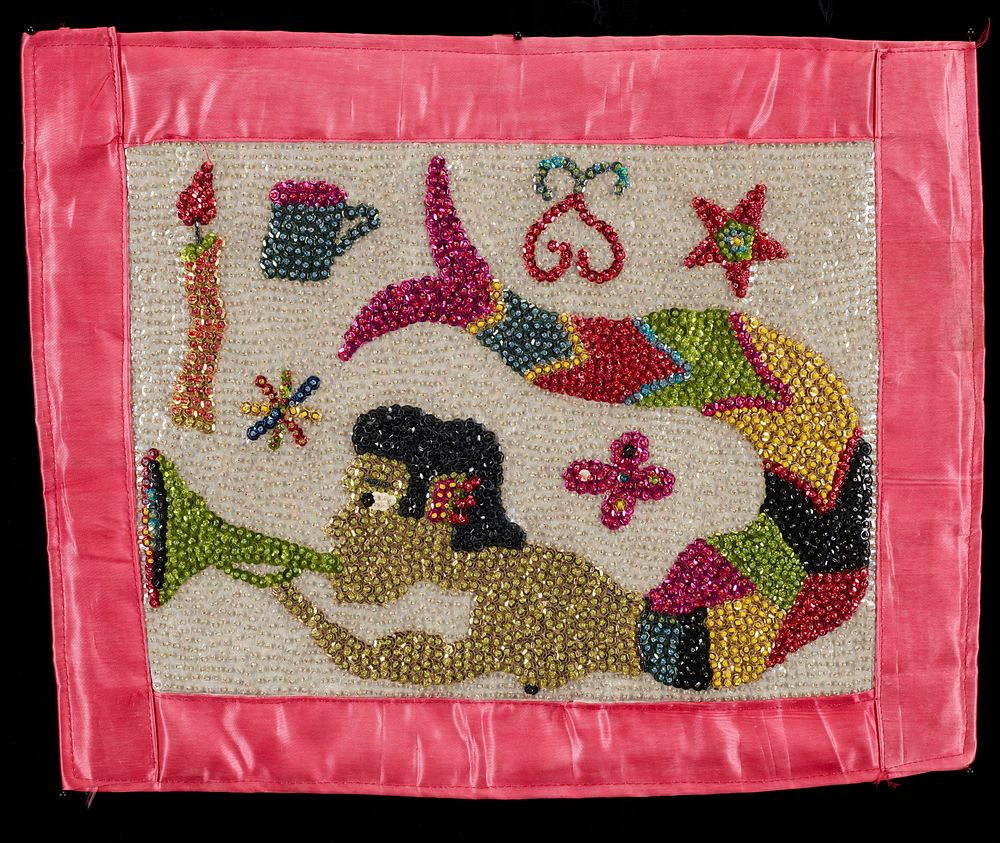 beaded and sequined panel with pink trim and backing; mermaid blowing a green horn with flower, stars, coffee cup, candle…