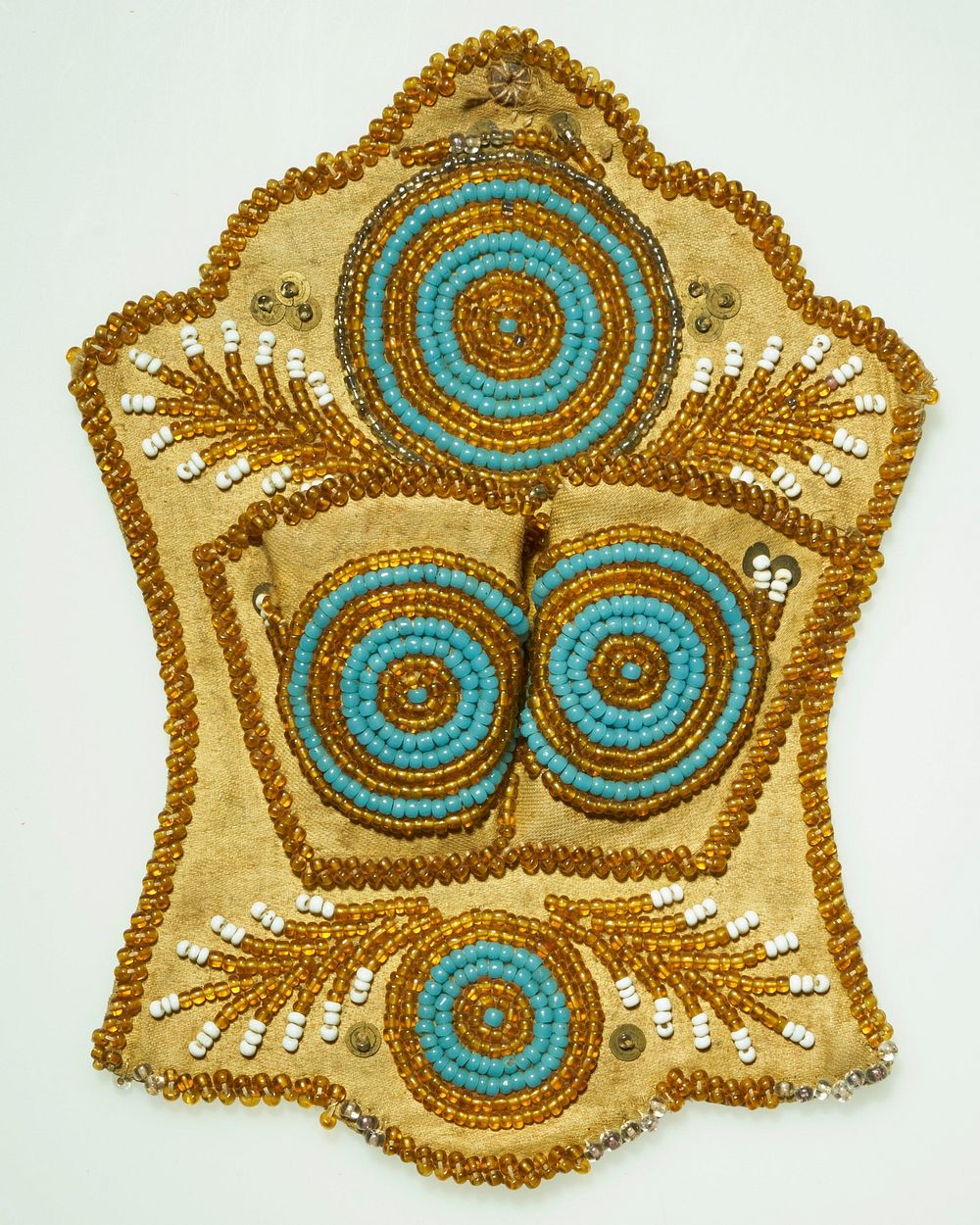 tan front and back; four concentric circle motifs in blue, orange, and grey beads; leaf-like shapes in orange and white…