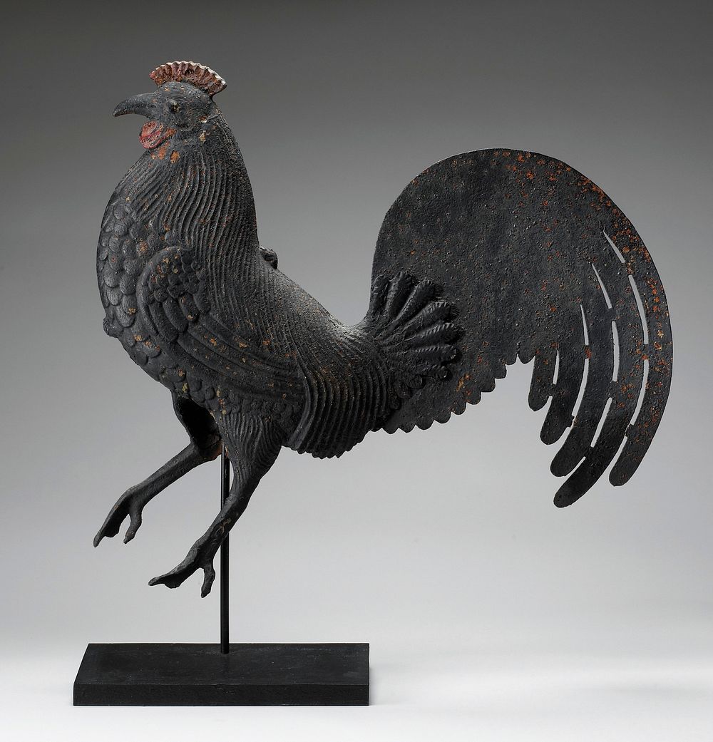 realistic walking rooster with PR foot raised; flat tail; black patina with red comb and wattle; feathers delineated overall…