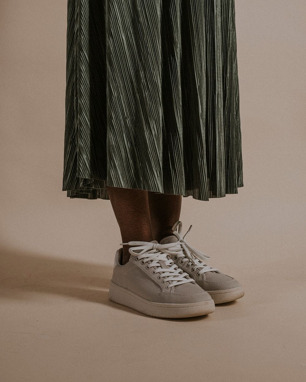 Women's green skirt, gray sneakers