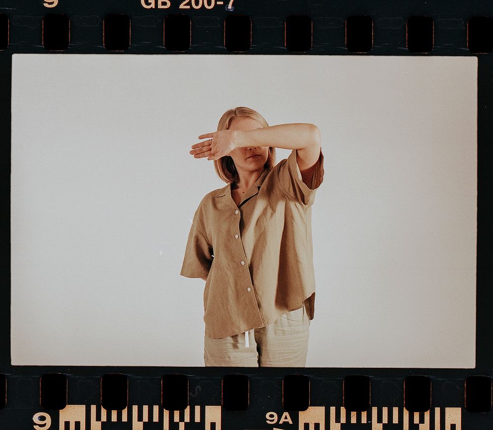 Woman wearing beige shirt, pants, minimal loungewear