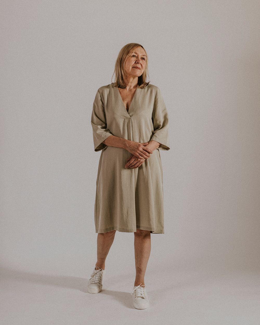 Mature woman wearing linen dress, minimal fashion