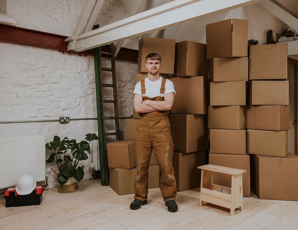 Moving service provider, man in overalls, job & career photo