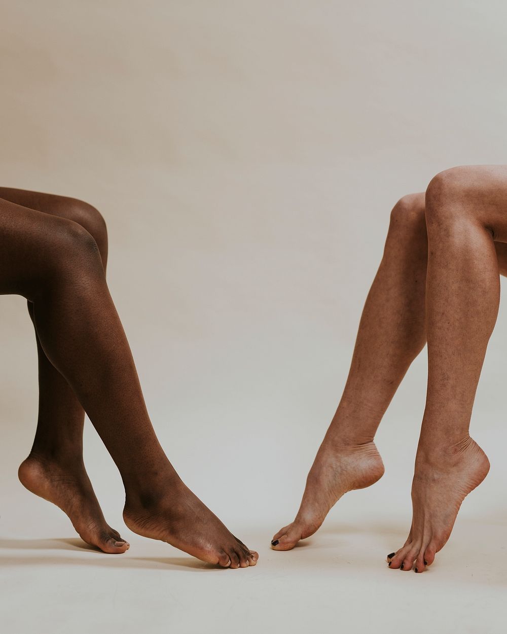 Different skin tone women's legs photo