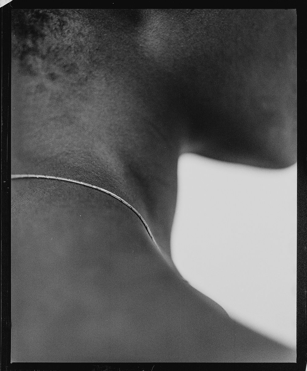 African woman neck, closeup black & white photo