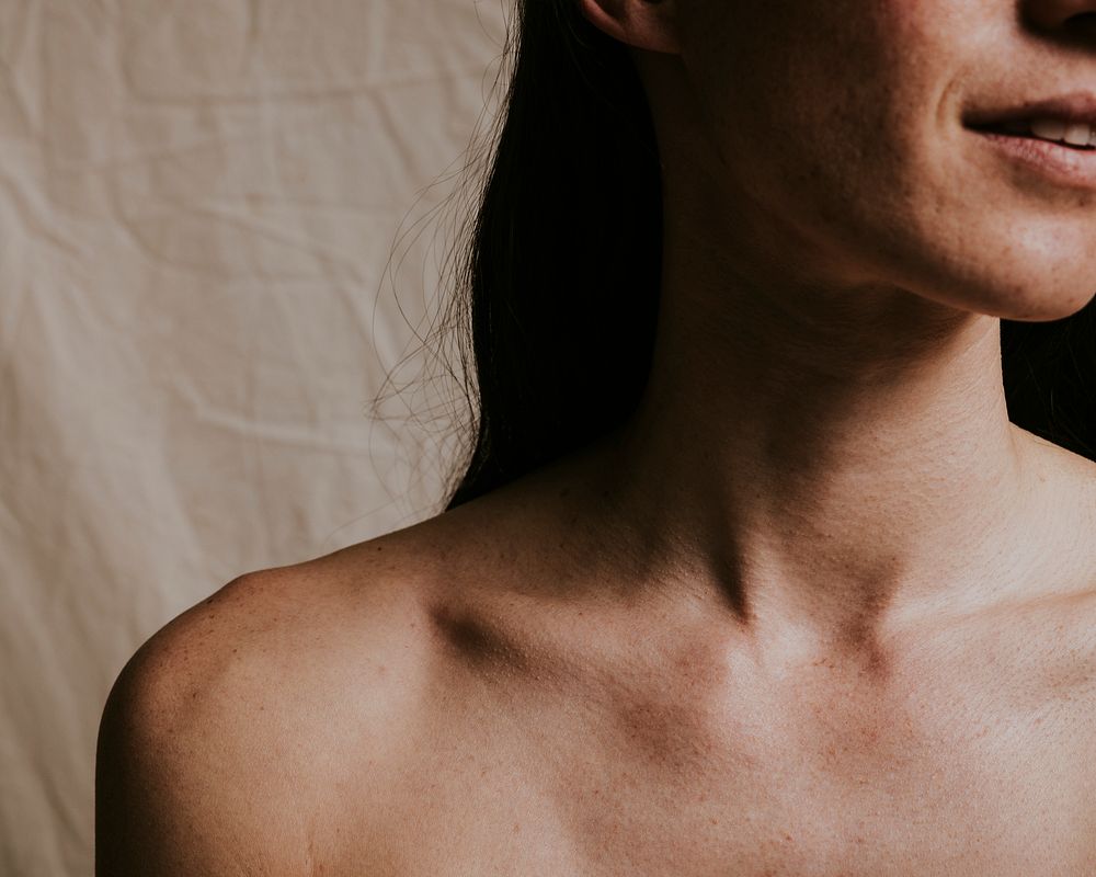 Woman, bare neck & shoulders closeup photo