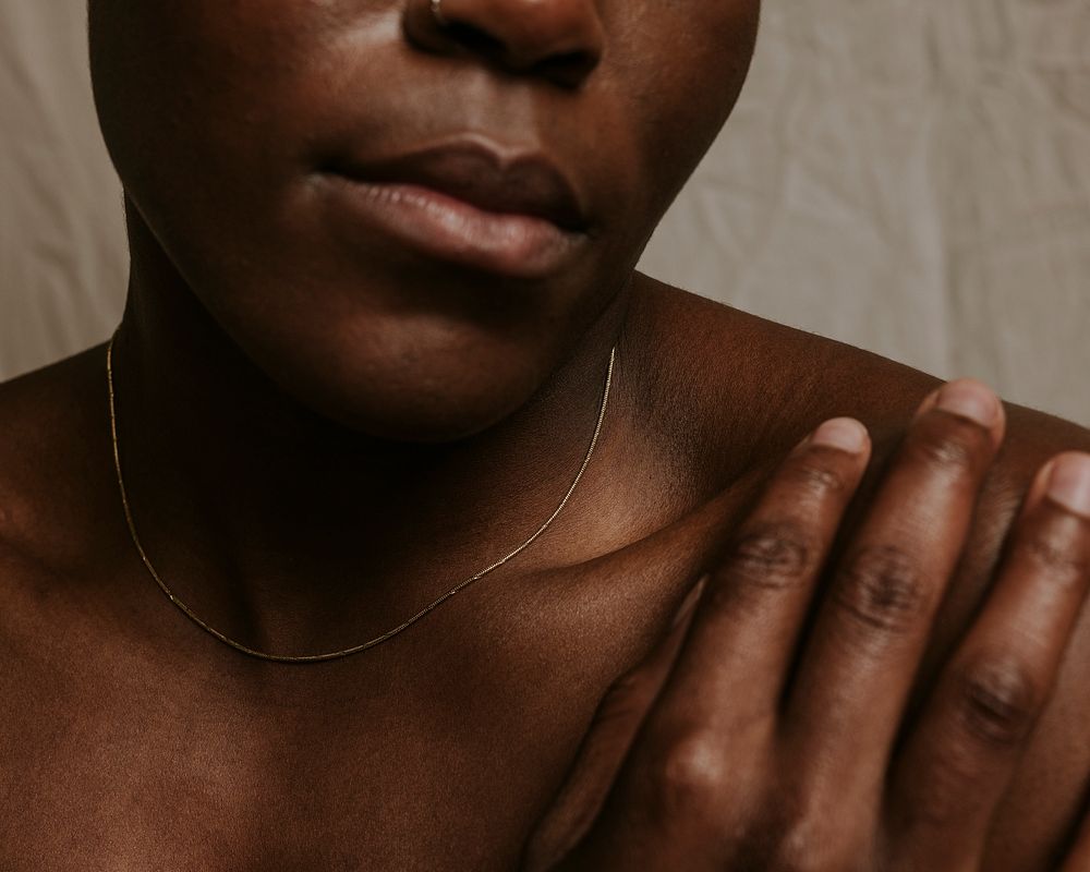 African woman, bare shoulders closeup photo