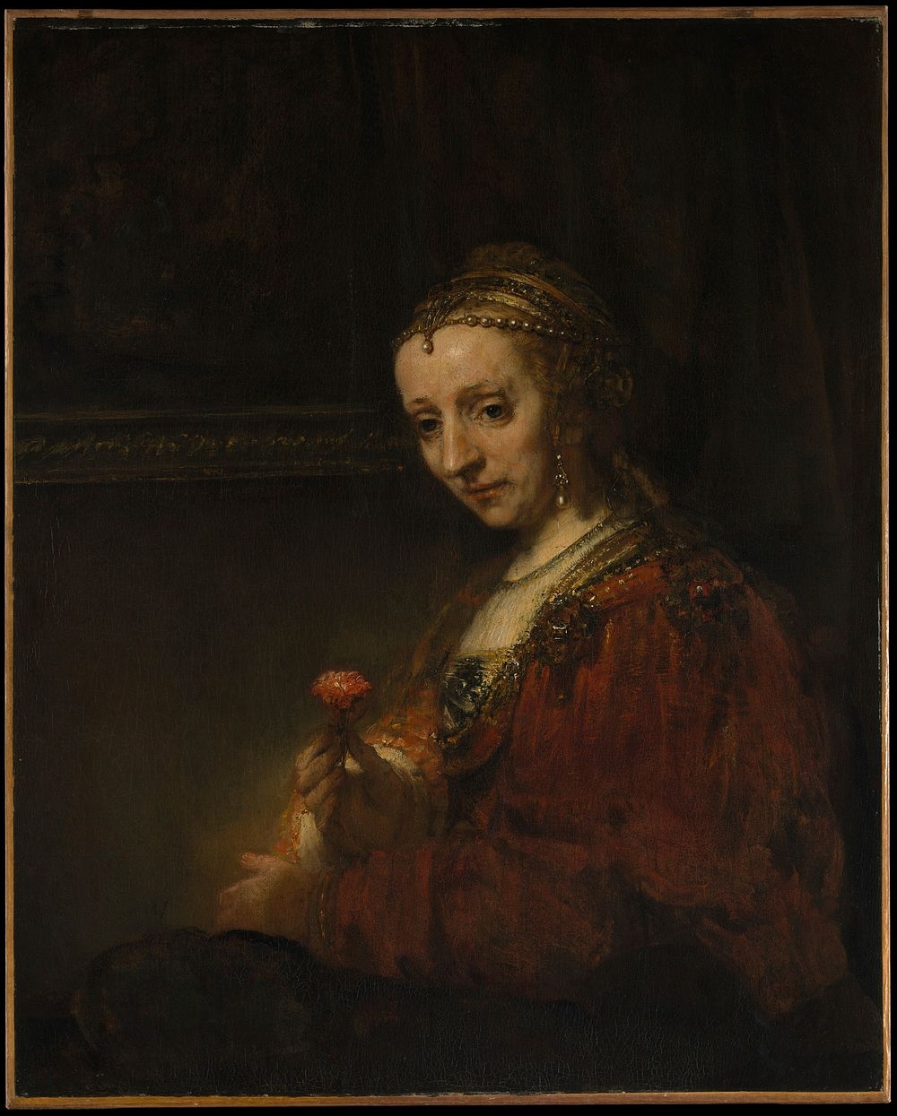 Woman with a Pink by Rembrandt van Rijn