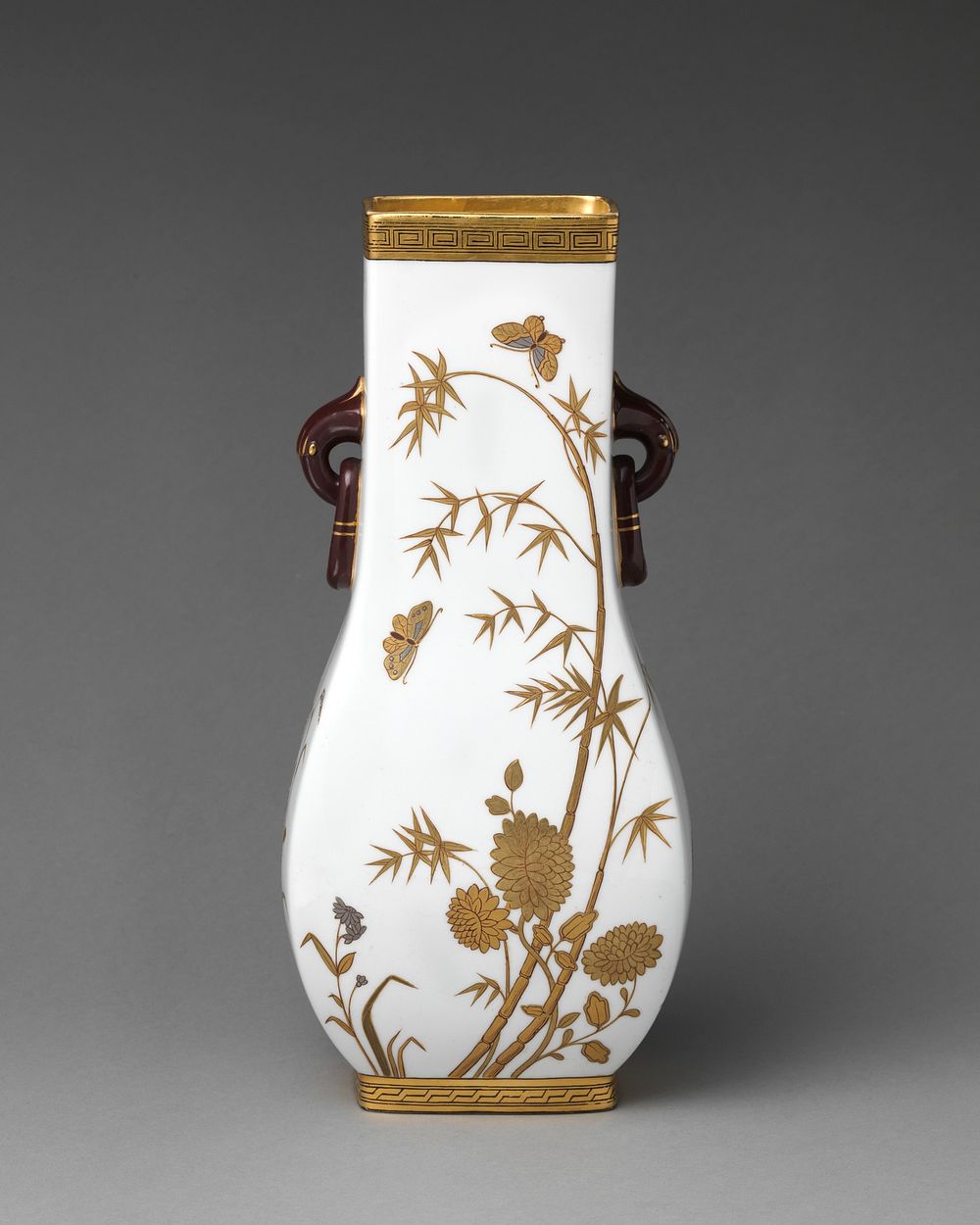 Vase with white and gold floral motifs and ring handles