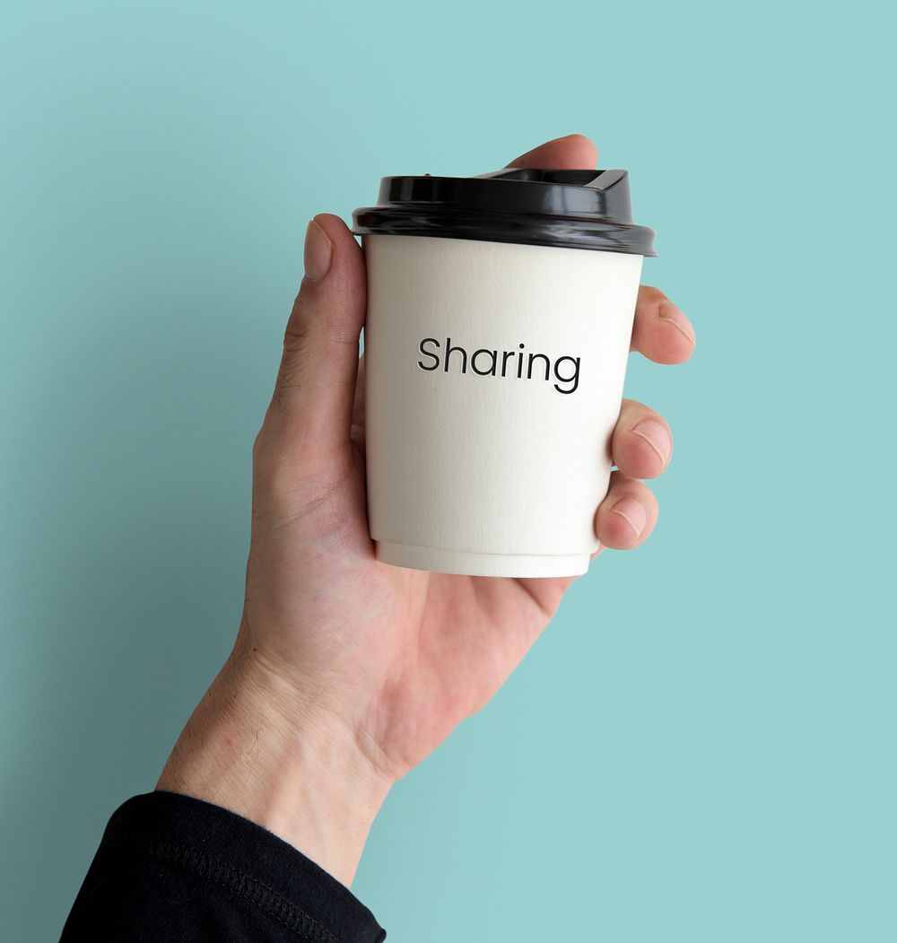 Hand holding network graphic overlay coffee cup