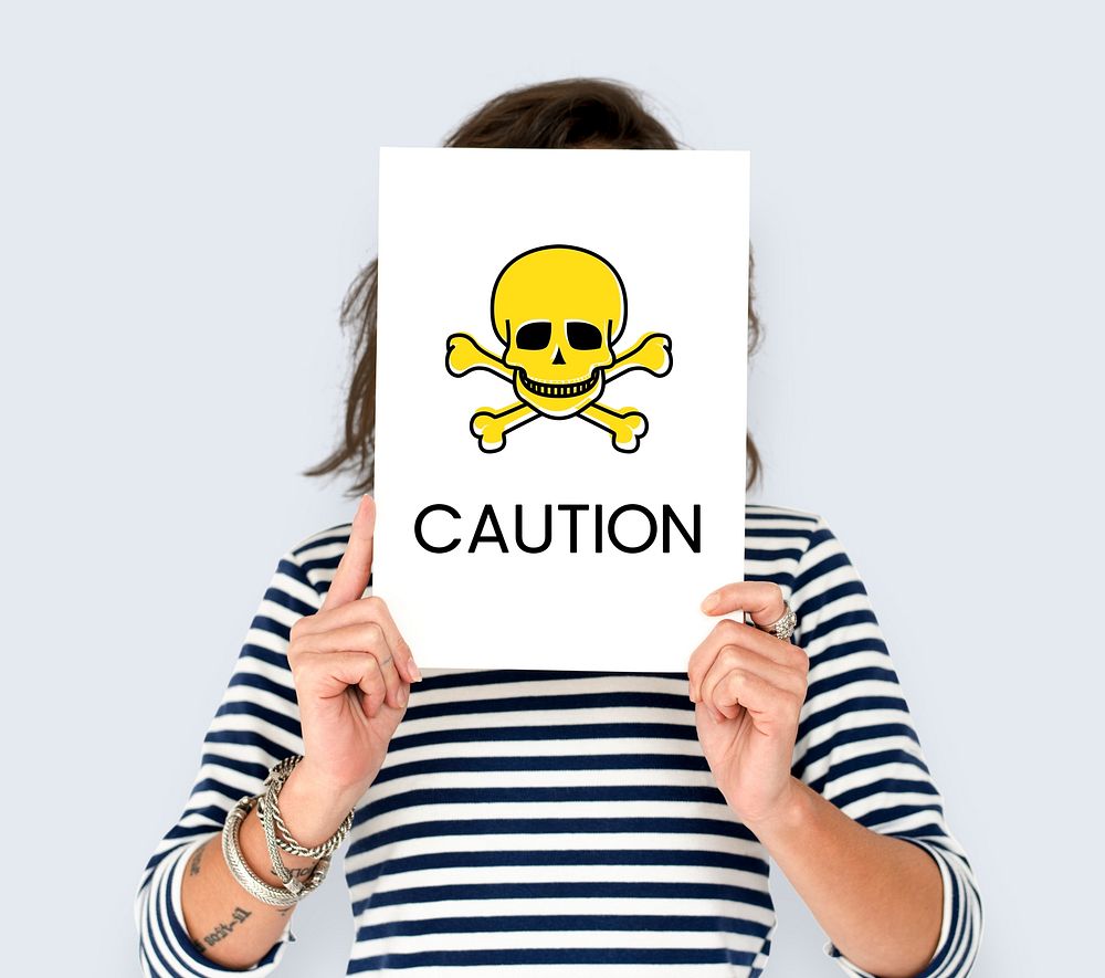 People holding placard with skull icon and chemicals dangerous