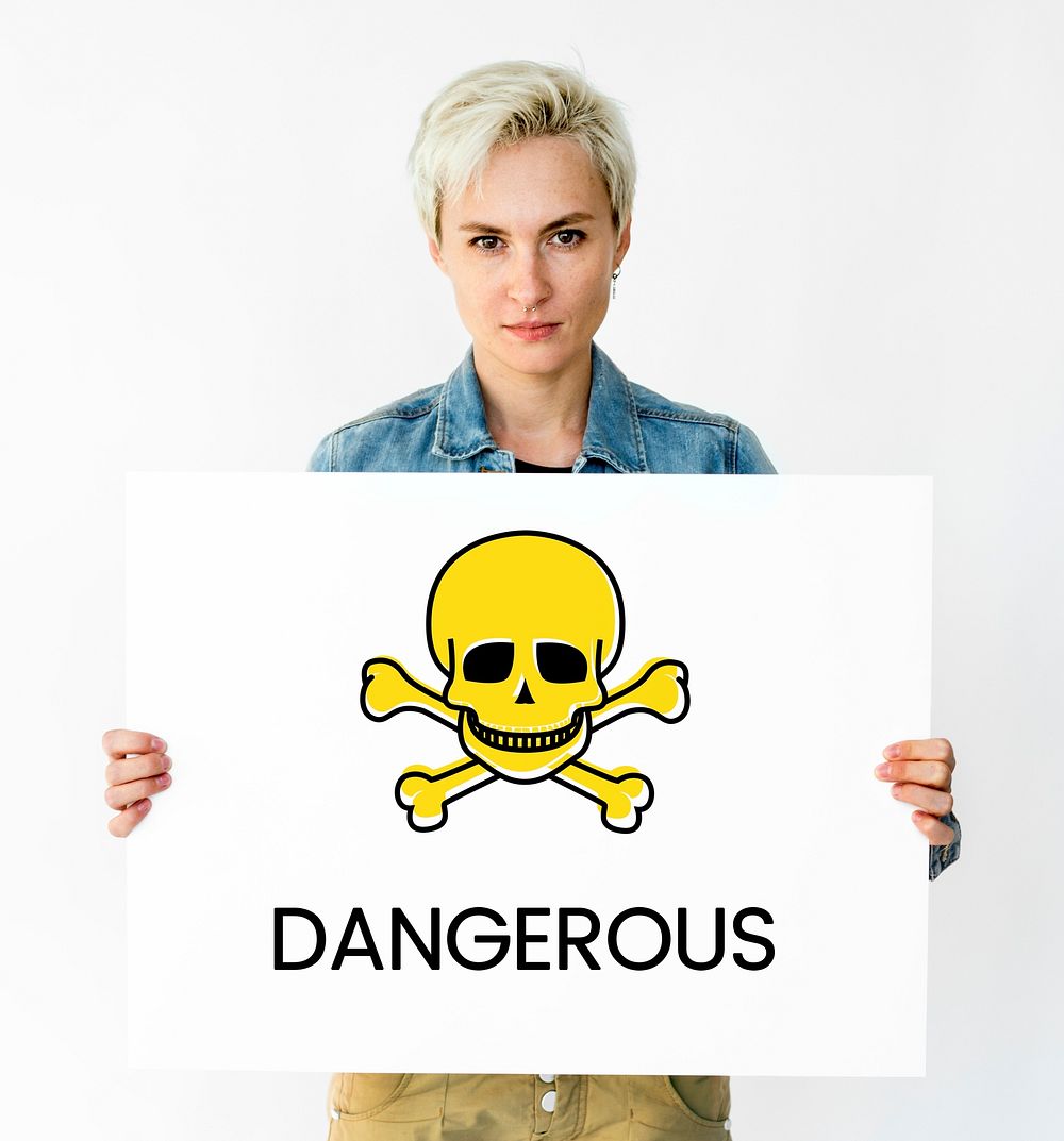 People holding placard with skull icon and chemicals dangerous