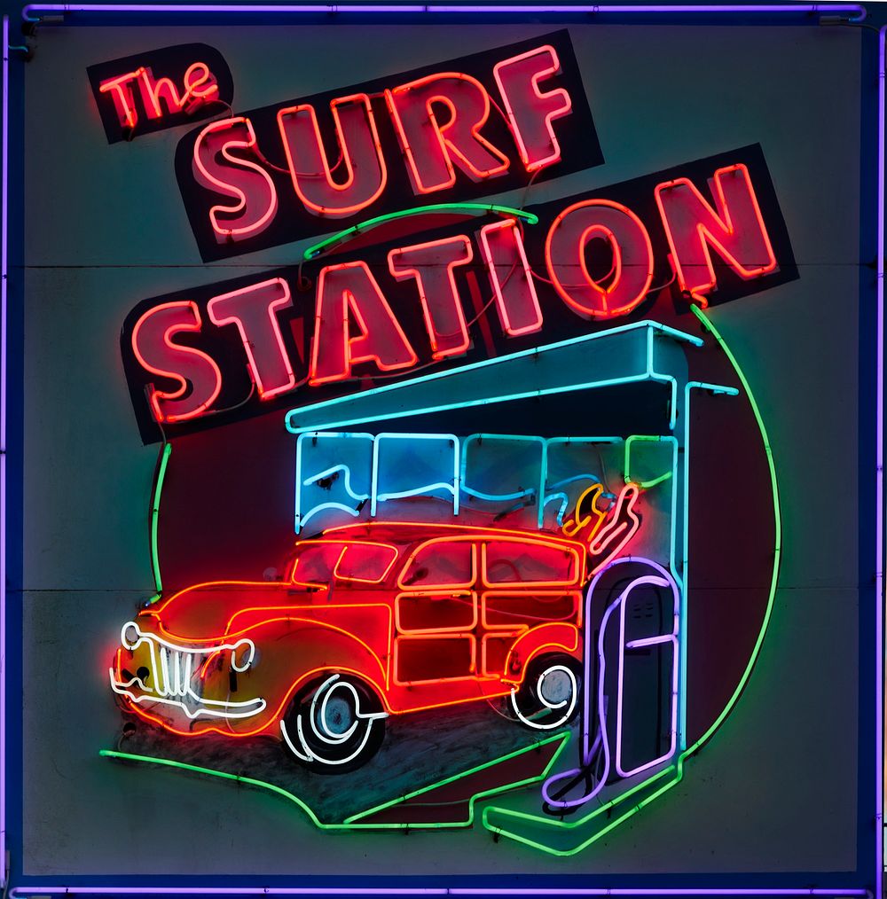                         Neon sign for the Surf Station store, which sells surfboards, wetsuits, and beachwear in St.…