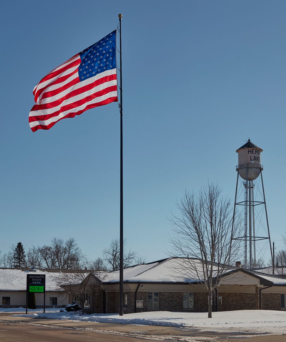                         A new American flag and an old water tower in Heron Lake, Minnesota                        