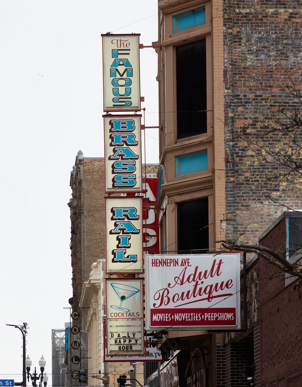                         Signs for the Brass Rail Cocktail Lounge and adjacent "adult boutique"  in downtown Minneapolis…