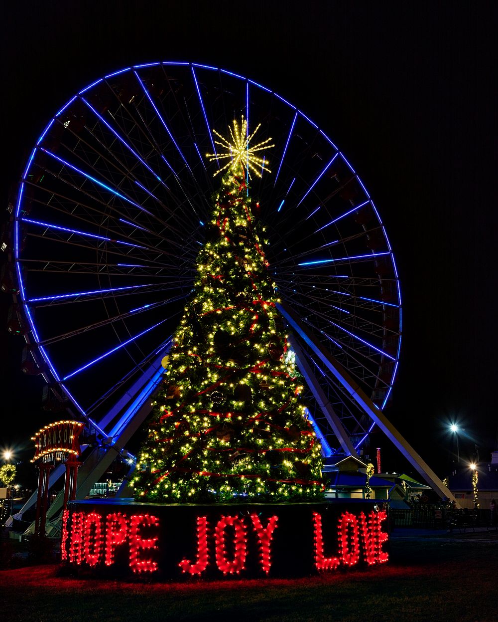                         The signature "United We Stand" Christmas tree, next to the attraction's giant Ferris wheel in…