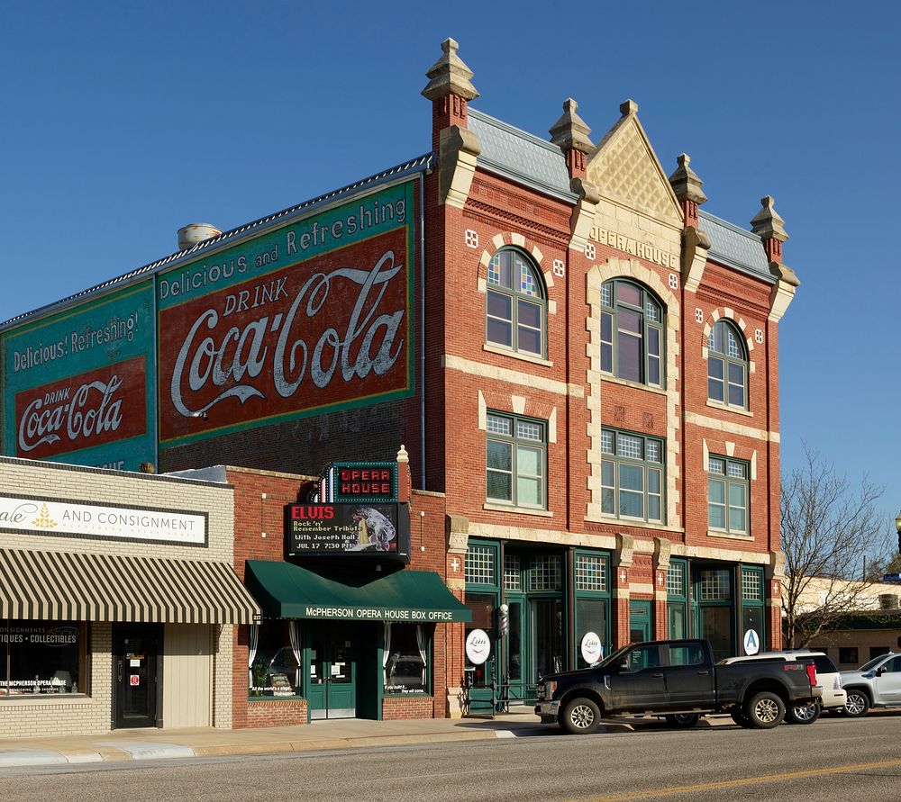 Two Coca-Cola signs dominate one side of the 1888 McPherson Opera House in McPherson, Kansas, which was founded in 1872 and…