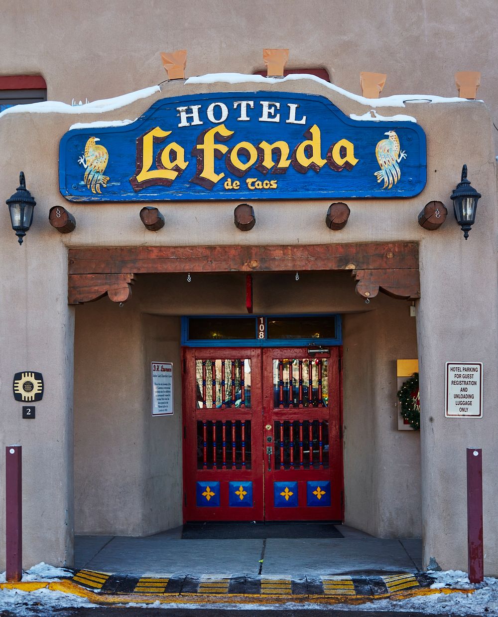                         Entrance to the La Fonda de Taos Hotel on the plaza, or town square, in Taos, New Mexico, once a…