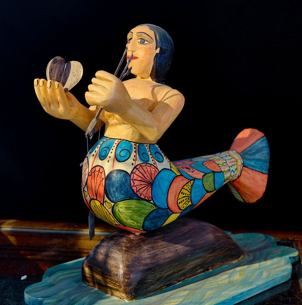                         A painted mermaid sculpture for sale at the El Potrero Trading Post, a little gift and spice store…