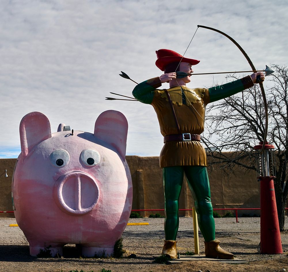                         A pink pig and Robin Hood keep unlikely company at Sparky's Burgers & BBQ (barbecue), a must-see…
