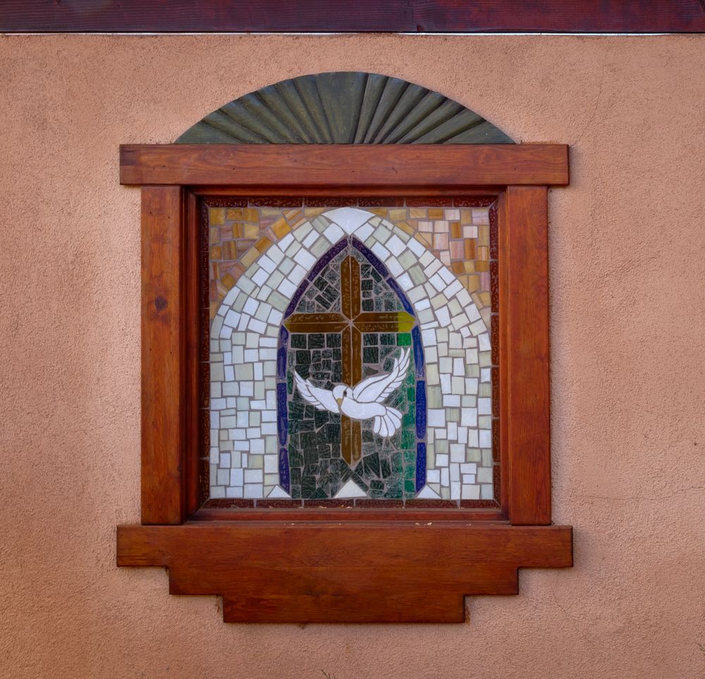                         One of several small stained-glass windows of the El Santuario de Chimayo, a humble but incredibly…