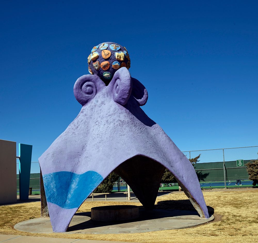                         Artist Andrew Nagem's purple "thing," reminiscent of an octopus, which he named "Refuge," serves as…