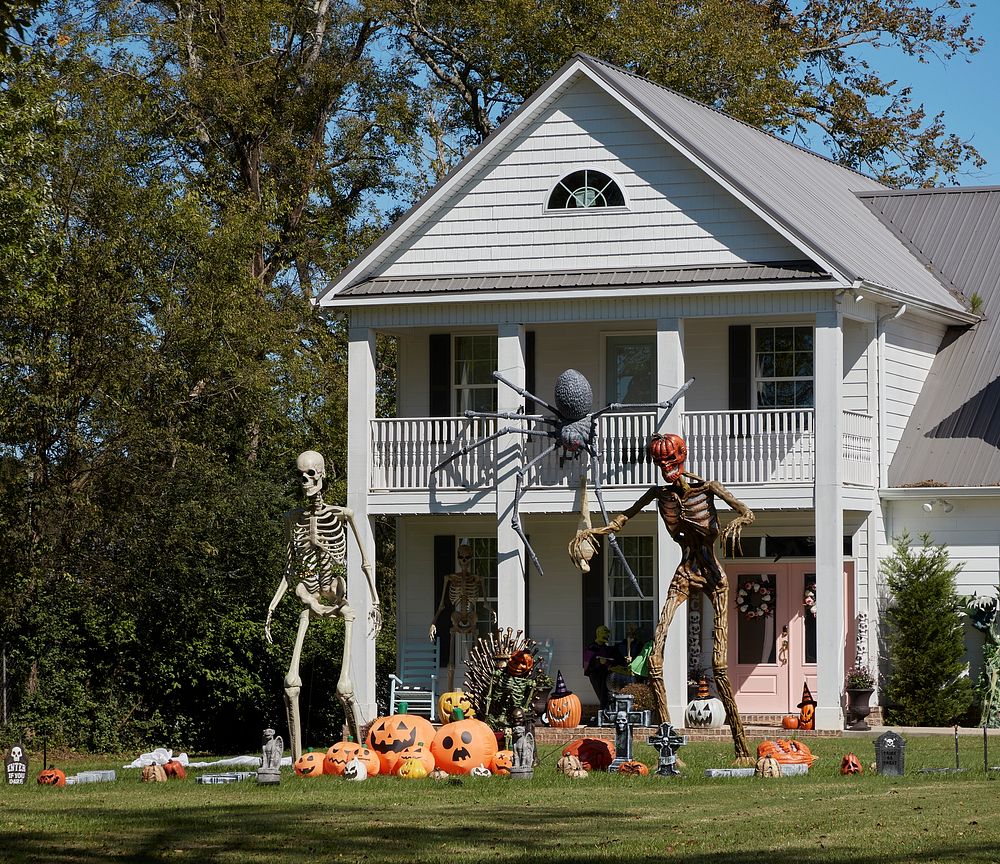                         Not monstrous Halloween figures but monstrously large ones loom outside a farmhouse in Cannon…