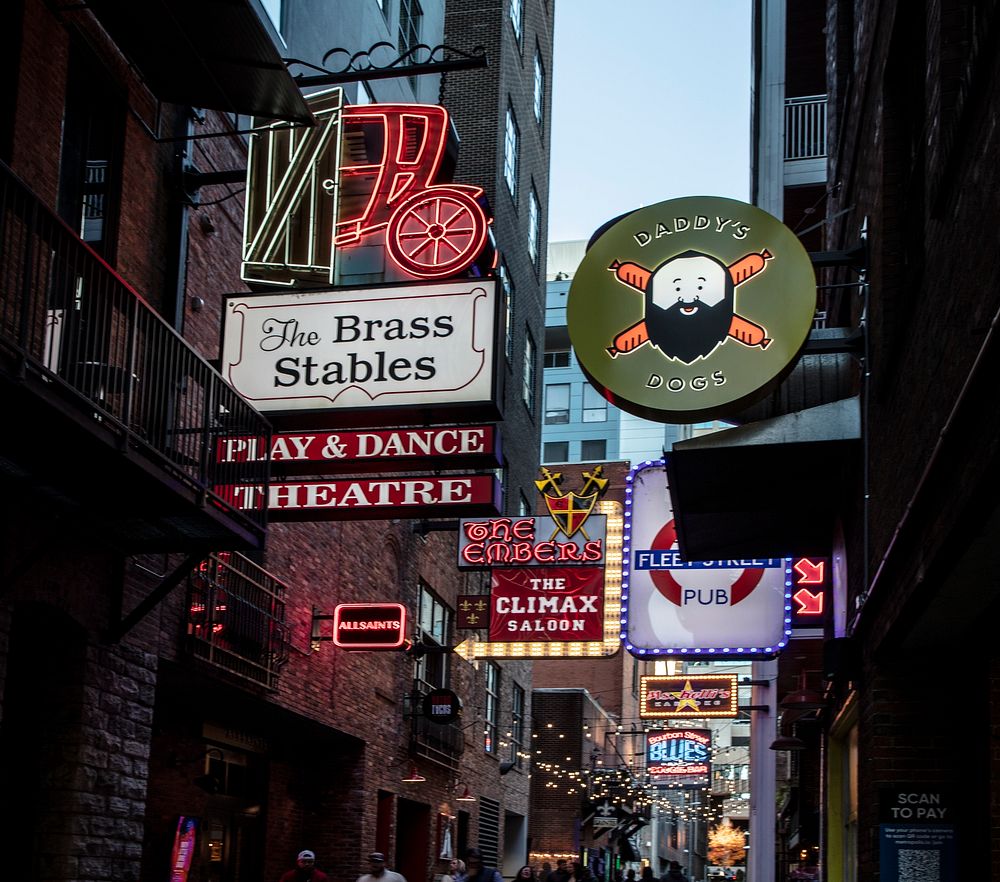                         Dusk approaches in the crowded entertainment district of Nashville, the capital city of the U.S. mid…