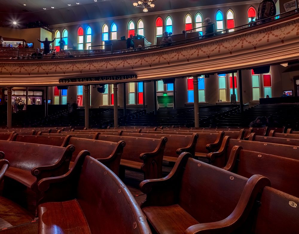                         The pew-like seating and church-like windows of the legendary 2,362-seat Ryman Auditorium concert…