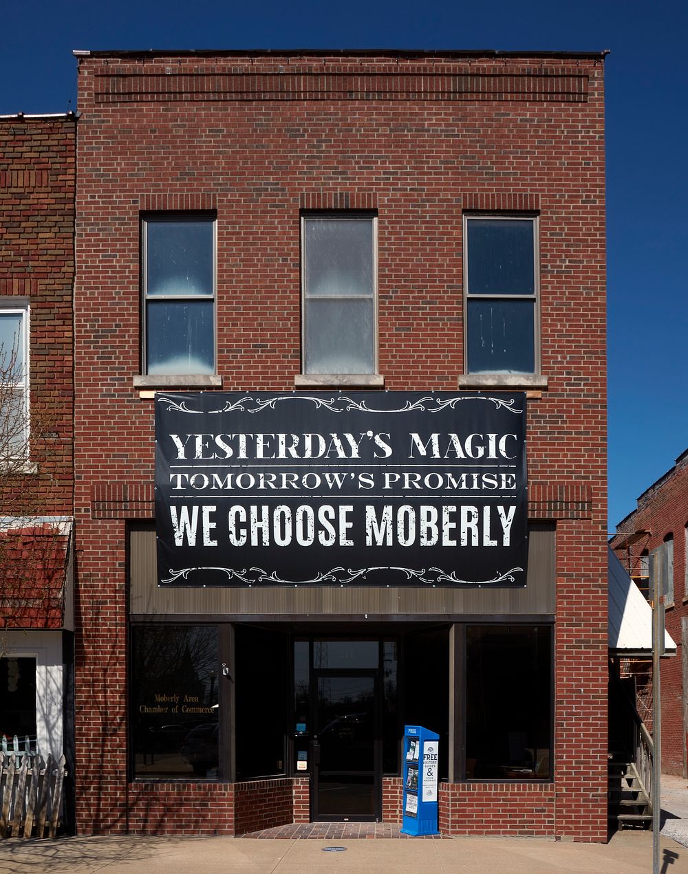                         A sign above the door of a downtown commercial building touts Moberly, Missouri's, history and…