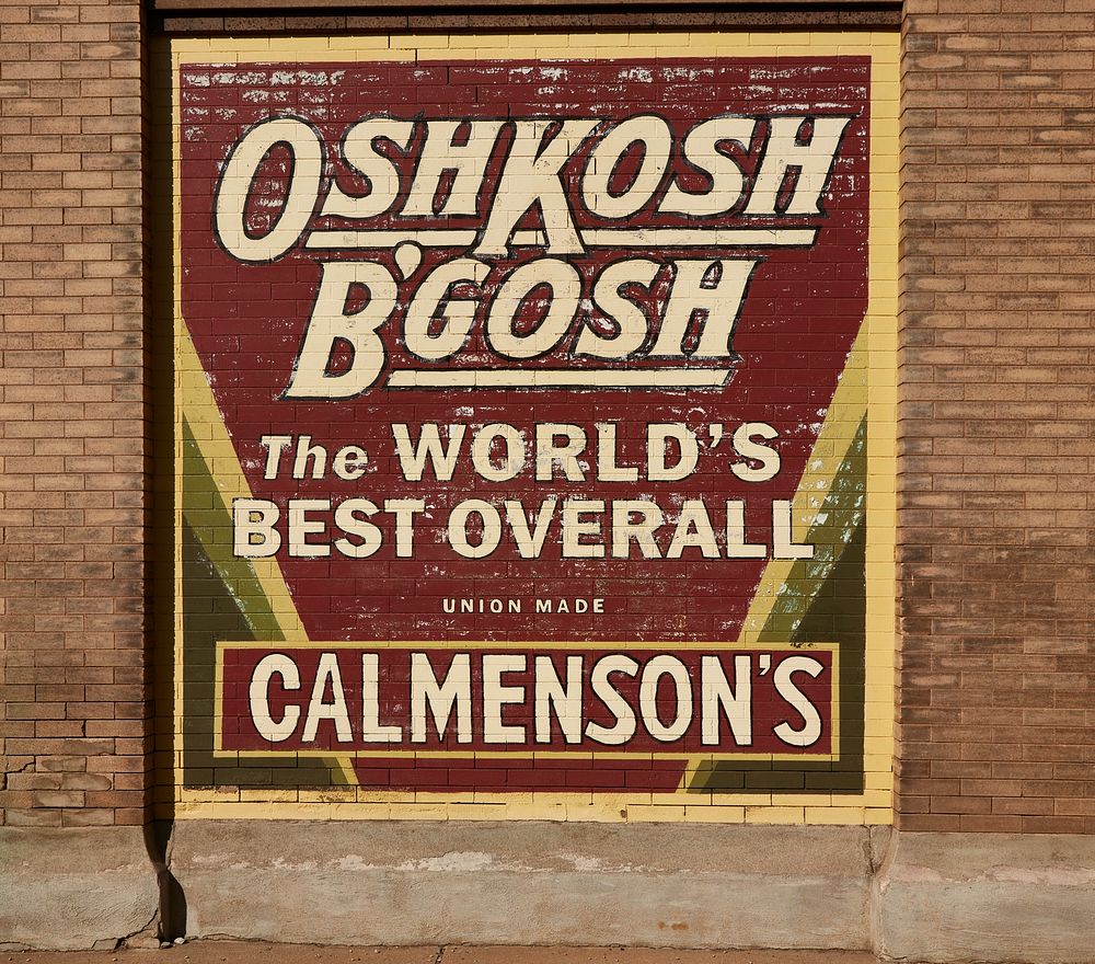                         Vintage Oshkosh B'Gosh overall company advertising sign on a wall in downtown Aberdeen, a small city…