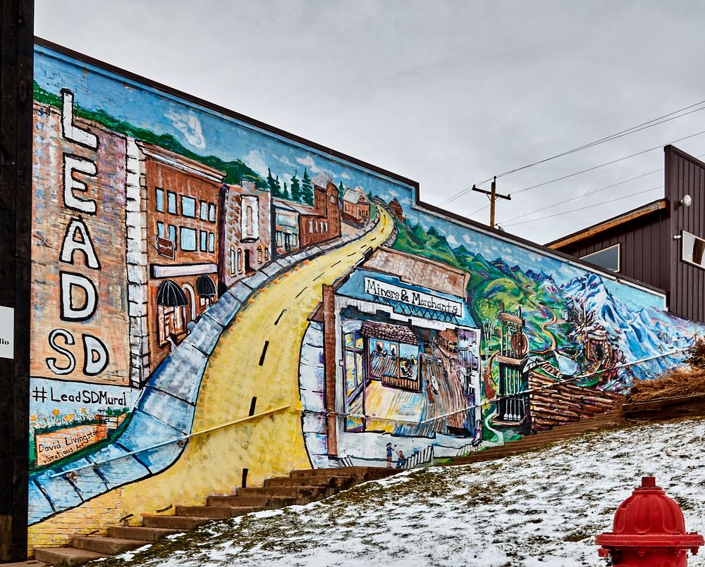                         A mural that captures the colorful history of Lead, a onetime gold-mining boomtown in the Black…