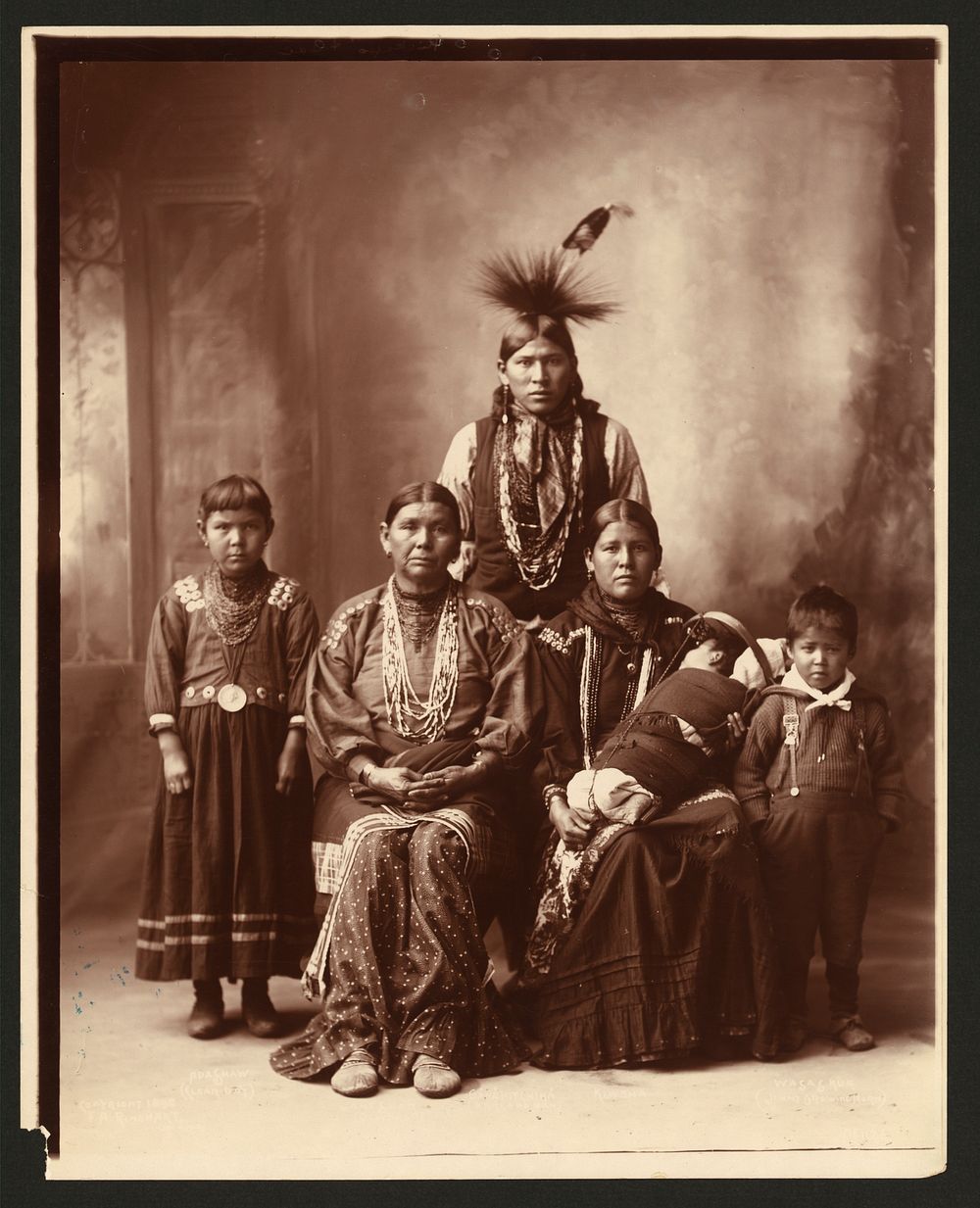 [Sauk Indian family, full-length portrait] / F.A. Rinehart, Omaha.