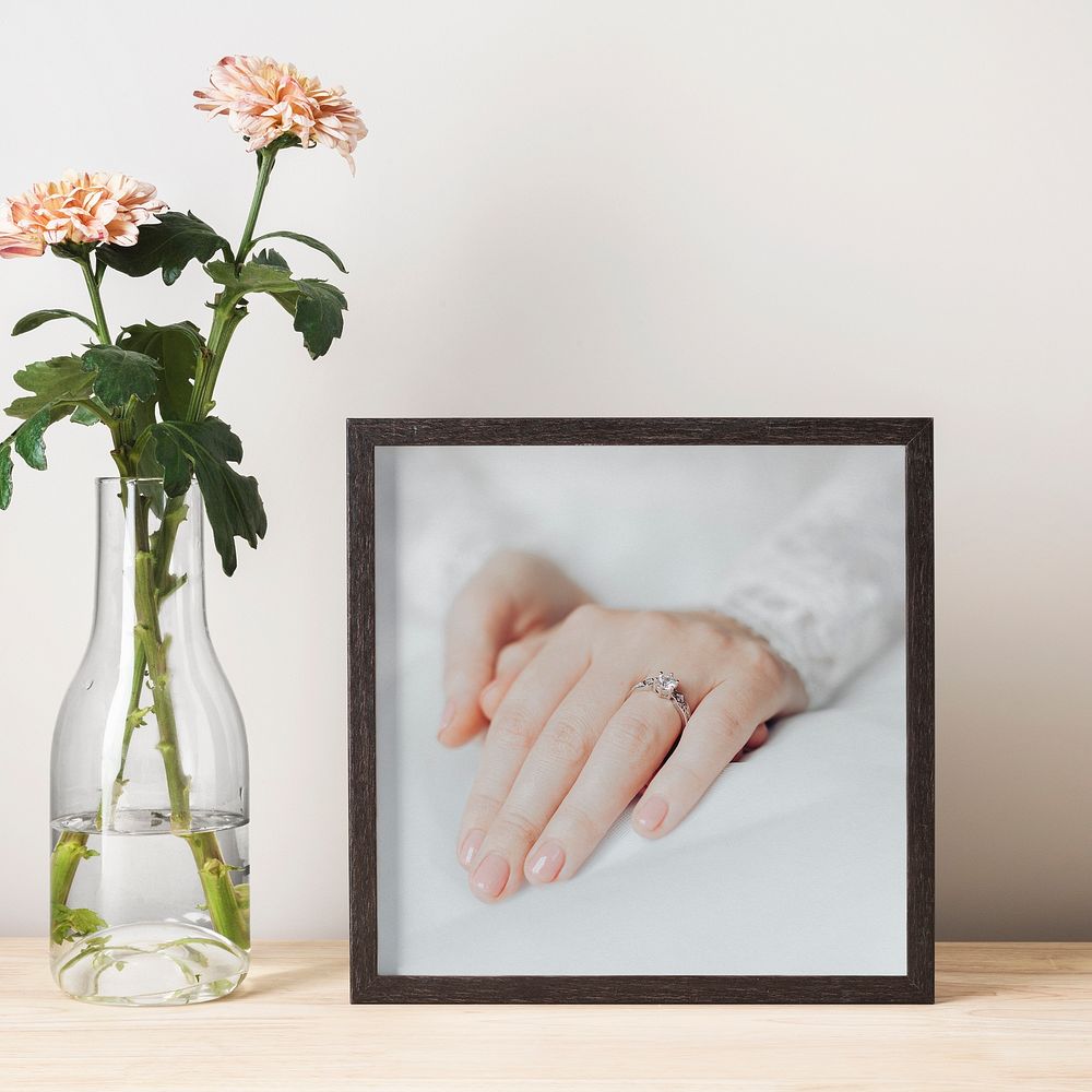 Wedding ring on bride's finger framed photo