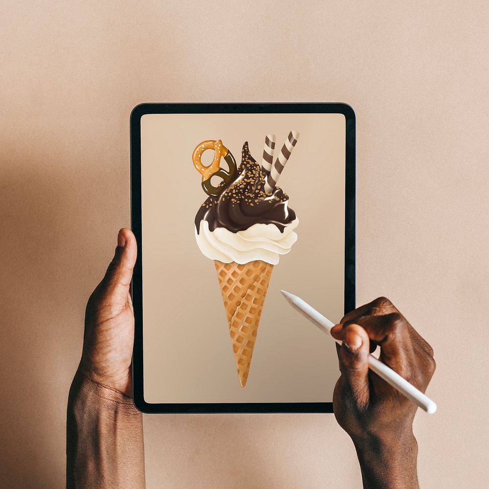 Black man using digital tablet, ice-cream illustration on screen