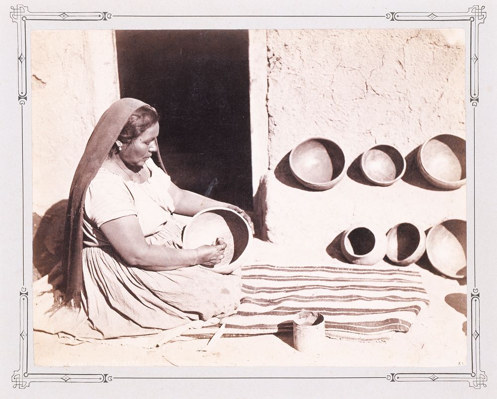 Woman Polishing Pottery