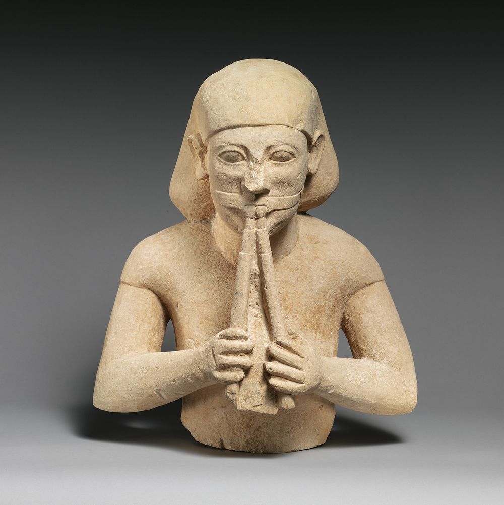 Limestone bust of a flute-player